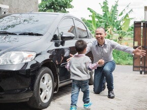 Asian toddler runs to his father, an OFW returning home for his annual leave