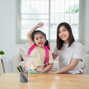 Asian mom and daughter excited to go to school